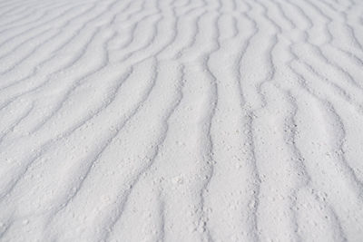 High angle view of tire tracks on snow