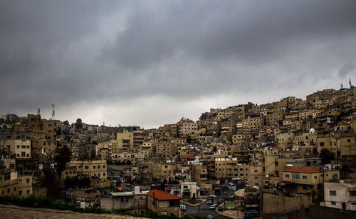 High angle view of buildings in town against sky