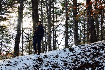 Man standing on snow covered land