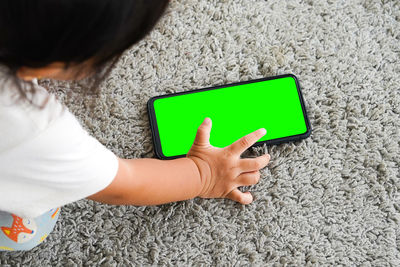 High angle view of woman using mobile phone