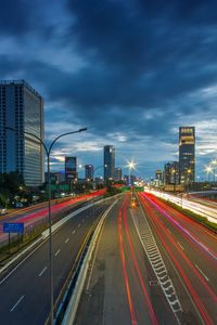 High angle view of light trails on highway at night