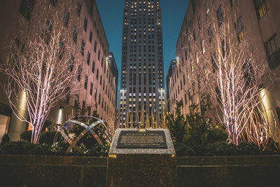 Illuminated buildings in city at night