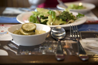 Salad served in plate on table at restaurant