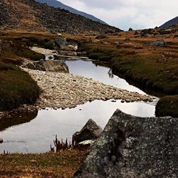 Scenic view of river and mountains