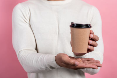 Midsection of woman holding ice cream