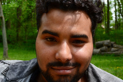 Close-up portrait of smiling young man