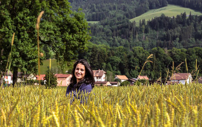 Portrait of smiling woman in farm