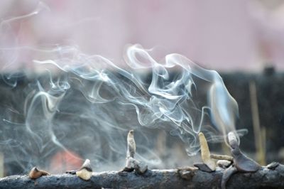 Incense stick fumes in temple of nainital, india