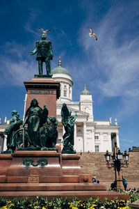 Statue against cloudy sky