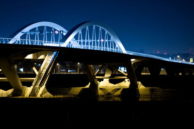 Bridge against clear sky at night