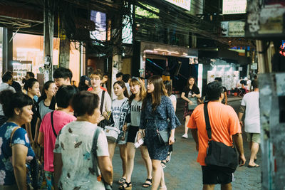 People walking on street in city