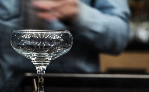 Close-up of hand holding glass of wine