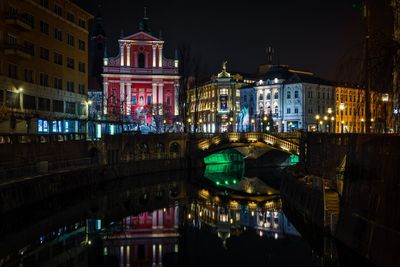 Illuminated buildings in city at night
