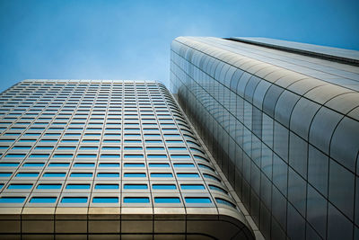 Low angle view of modern buildings against clear sky