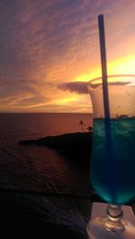 Close-up of sea against sky during sunset