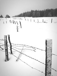 Scenic view of snow on field against sky