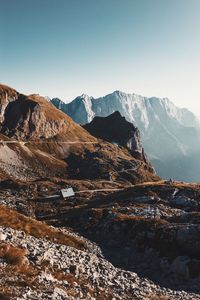 Scenic view of snowcapped mountains against clear sky