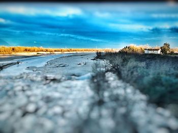 Surface level of beach against sky