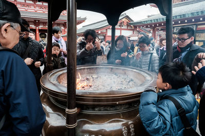 Group of people at market stall