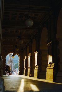 People in illuminated building