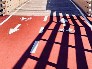 High angle view of shadow on footpath