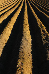 A plowed field. creating a furrow in an arable field, preparing for planting crops in the spring.