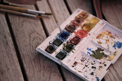 High angle view of paintbrushes on table