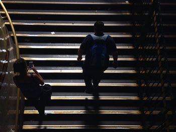 Woman standing in the dark