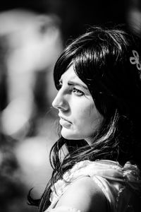 Portrait of woman looking away outdoors