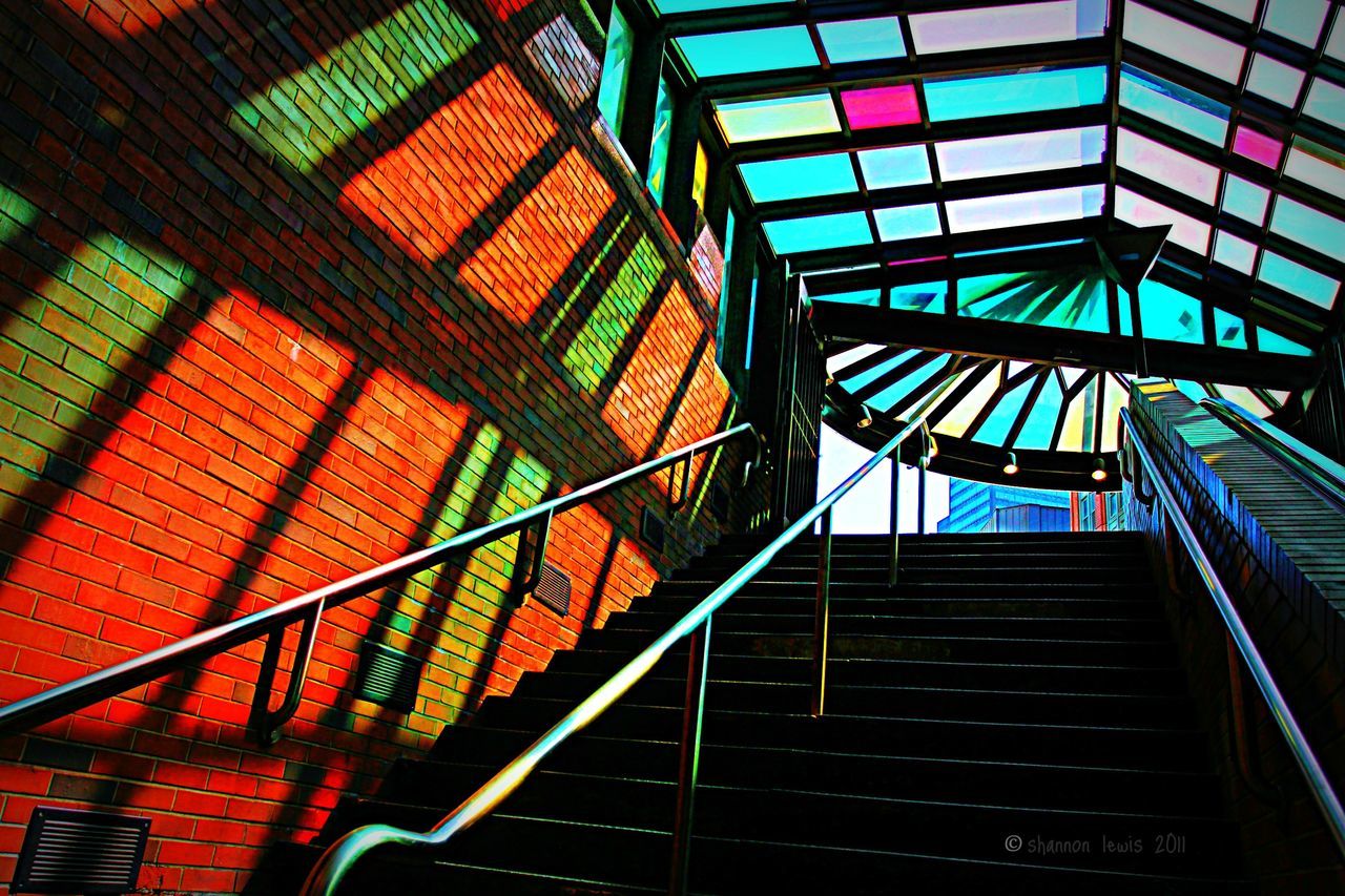 steps and staircases, steps, low angle view, architecture, built structure, staircase, railing, building exterior, building, indoors, pattern, no people, metal, day, sunlight, window, wall - building feature, brick wall, residential structure