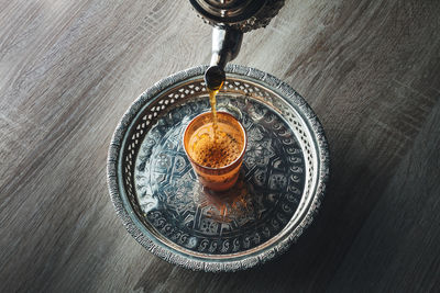 High angle view of coffee cup on table