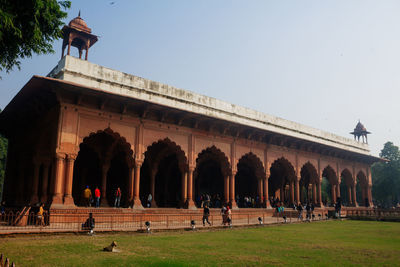 Group of people in front of historical building