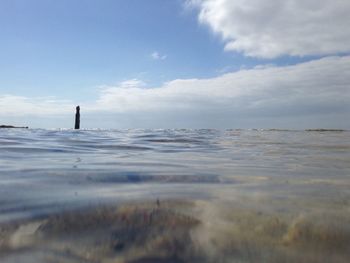 Surface level of frozen sea against sky