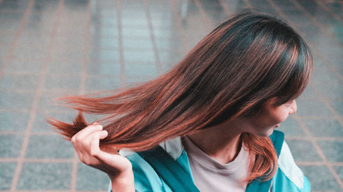 Close-up of young woman with long hair