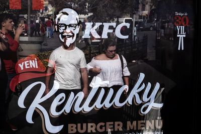 Portrait of young man and woman on text