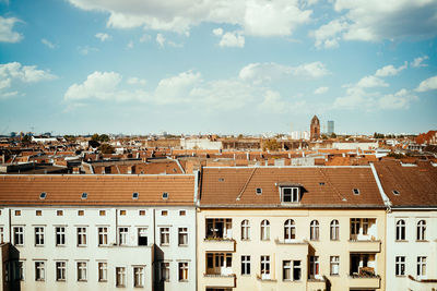 Houses in town against sky