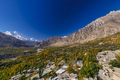 Scenic view of mountains against clear blue sky