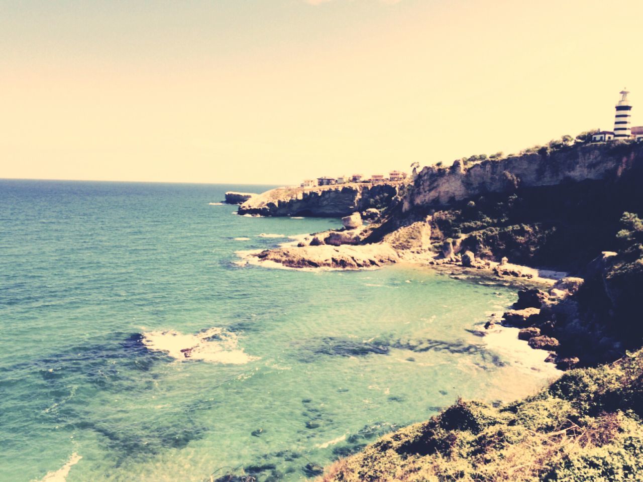 sea, water, horizon over water, scenics, tranquil scene, beauty in nature, tranquility, nature, clear sky, rock formation, cliff, coastline, rock - object, beach, idyllic, seascape, shore, wave, sky, rock