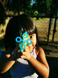 Portrait of girl holding toy