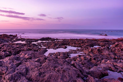 Scenic view of sea against sky at sunset