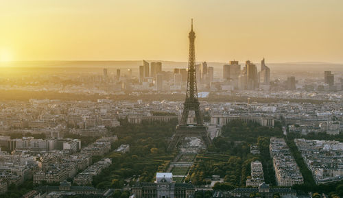 Aerial view of city buildings during sunset