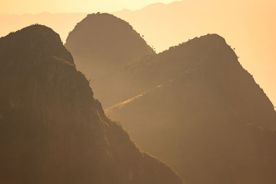 Scenic view of mountains against sky during sunset