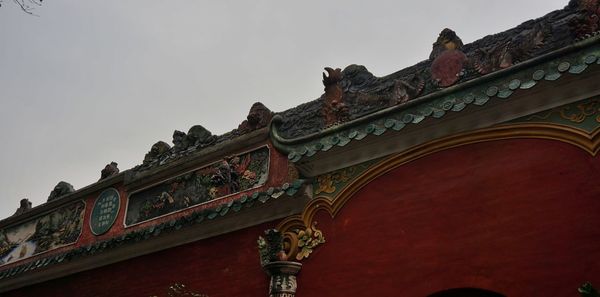 Low angle view of statue against sky