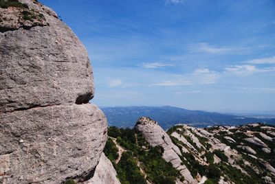 Rock formations on mountain against sky