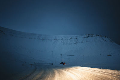 Low section of man standing in water