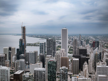 Modern buildings in city against sky