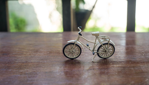 Close-up of toy bicycle on table