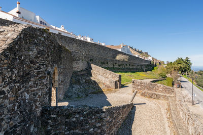 Low angle view of old buildings against sky