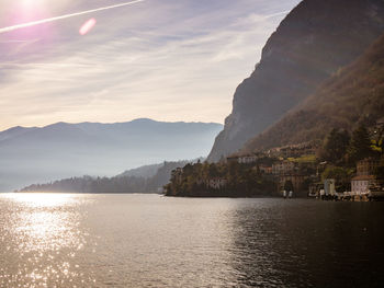 Scenic view of sea and mountains against sky