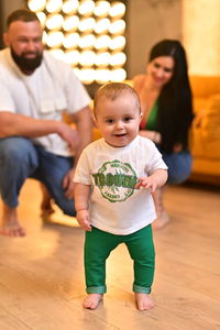 Midsection of woman with arms raised
